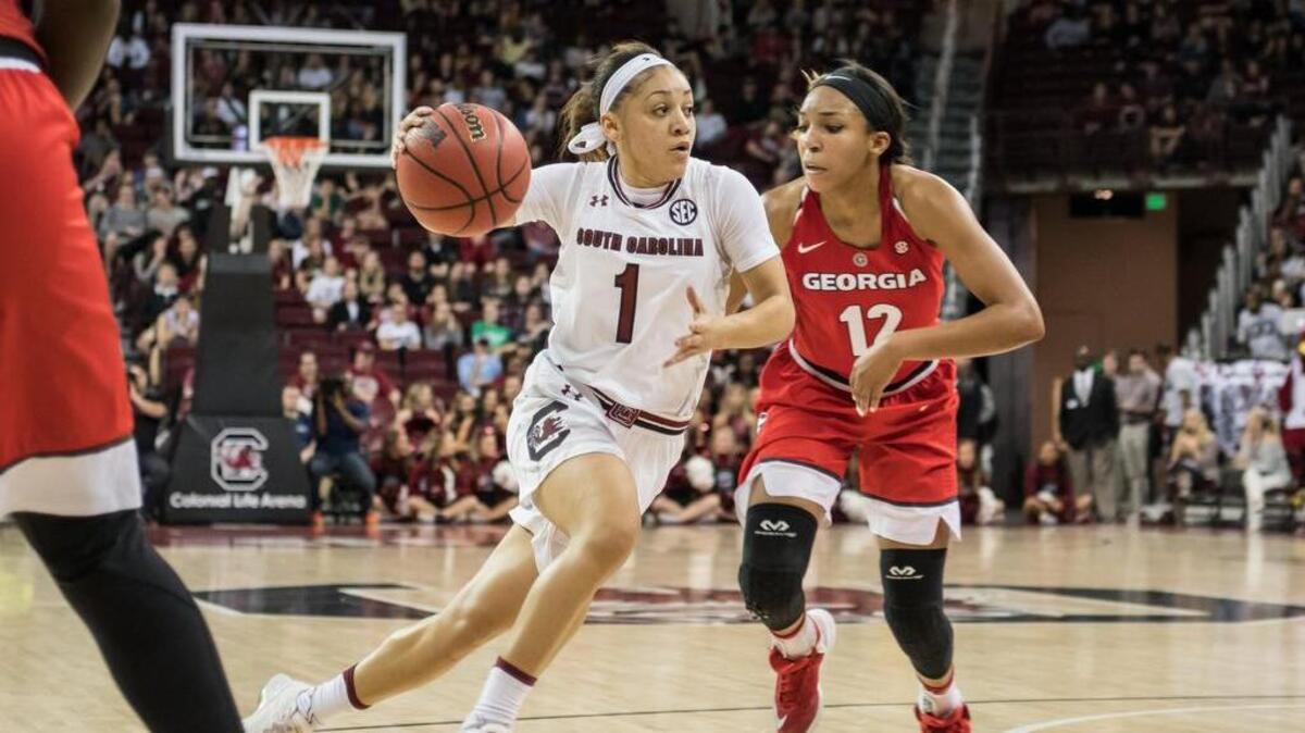 USC's Bianca Cuevas-Moore (1) takes a drive to the bucket against Georgia defender Haley Clark (12) on Thursday.