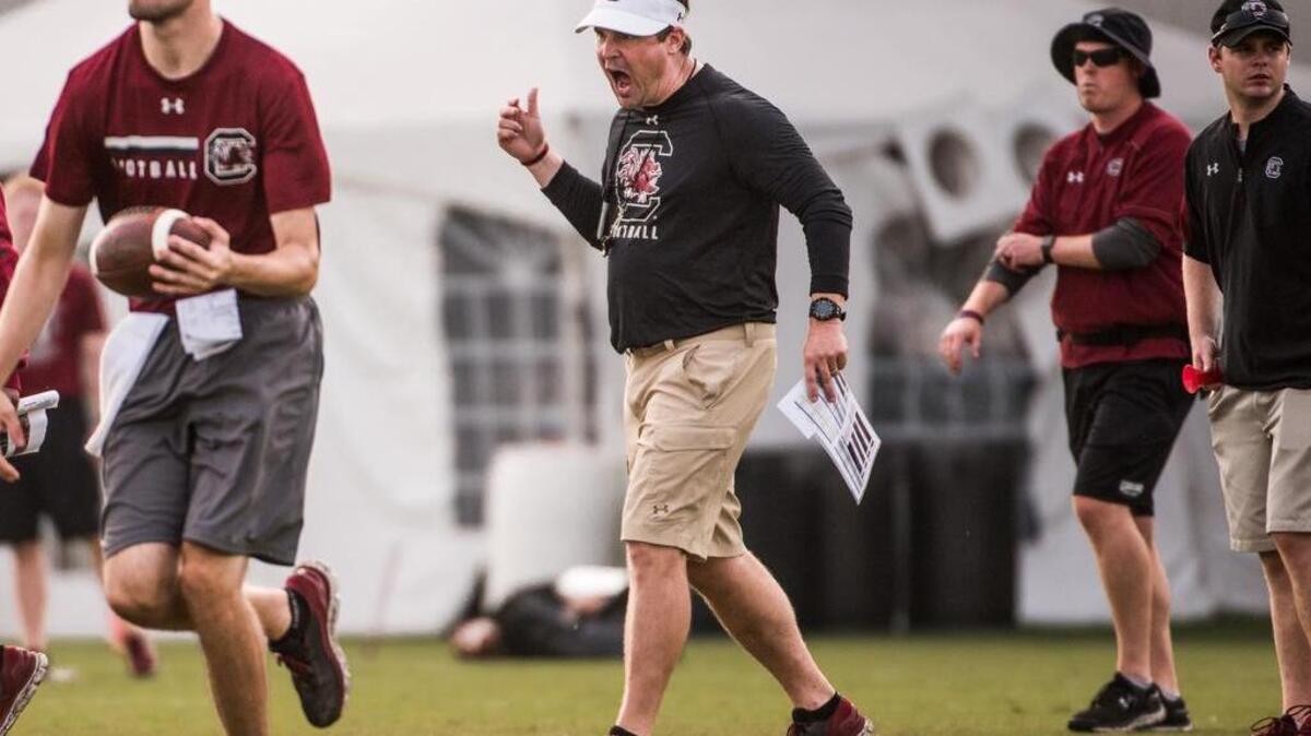 South Carolina head coach Will Muschamp encourages a faster pace from the offense during the first full day of practice with pads Saturday.