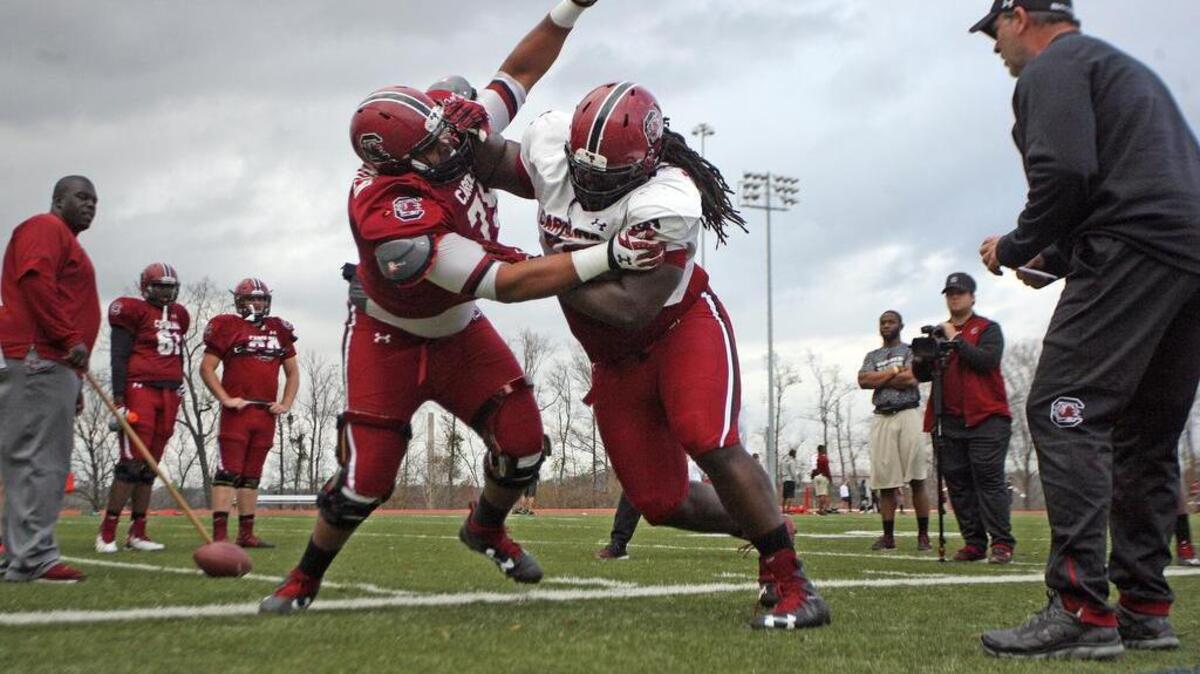 South Carolina offensive lineman Trey Derouen takes on defensive lineman Abu Lamin in a drill on Monday.