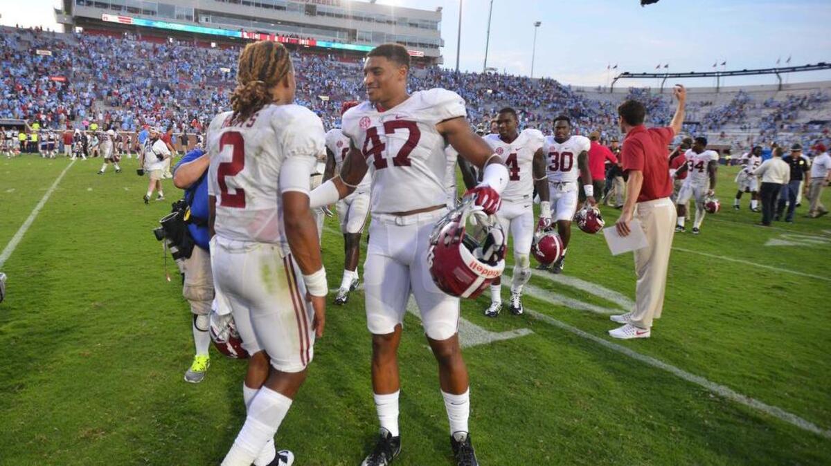 Columbia native Christian Miller (right) has worked his way into the linebacker rotation at Alabama this season.