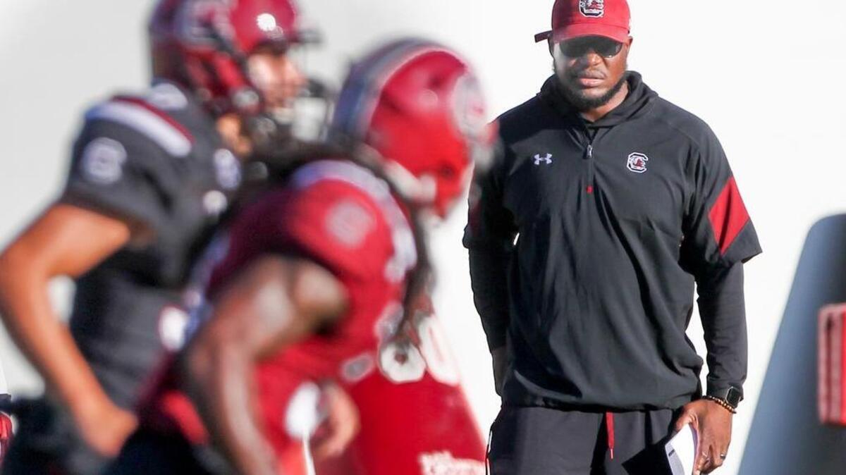 Outside linebackers coach Mike Peterson watches players during USC football practice at the South Carolina practice facility Tuesday.