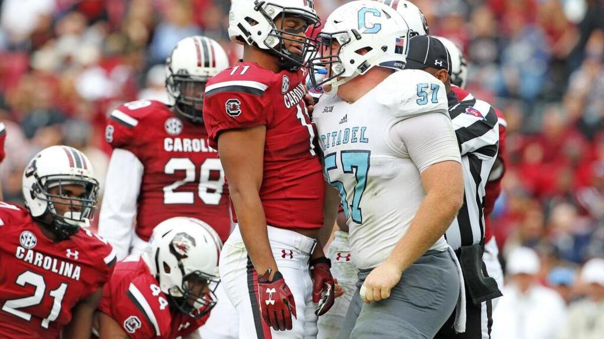 Despite being from a smaller program, the Citadel’s Kyle Weaver (57) – a Hilton Head Christian grad – wasn’t afraid to get into T.J. Holloman’s face.