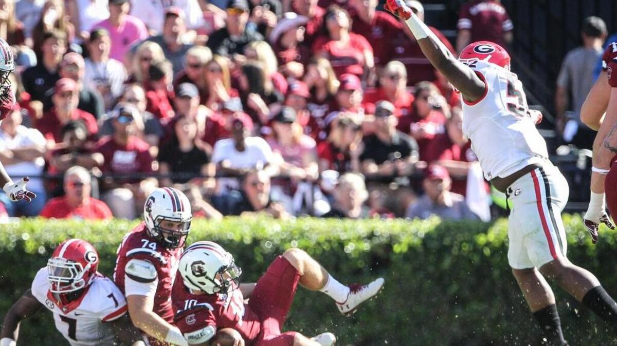 Quarterback Perry Orth is sacked against Georiga