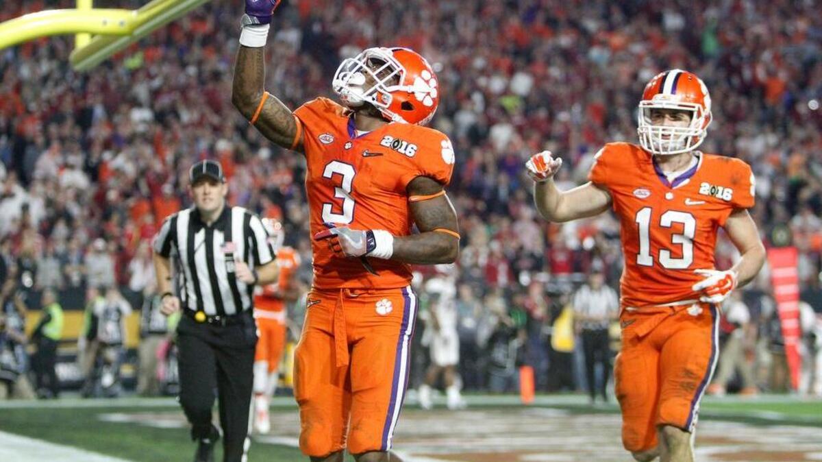 Clemson Tigers wide receiver Artavis Scott (3) and Hunter Renfrow (13) react a after a touchdown in last season’s national championship game.