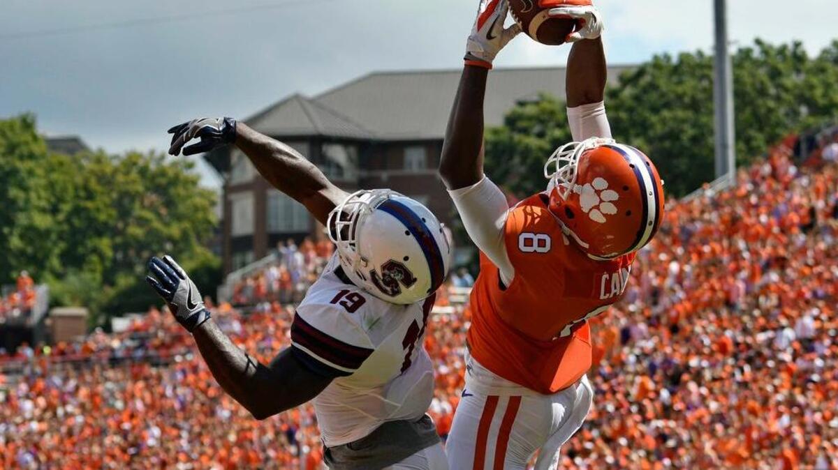 Clemson's Deon Cain, right, pulls in a pass for a touchdown while being defended by South Carolina State's Devondre Powell on Saturday in Clemson.