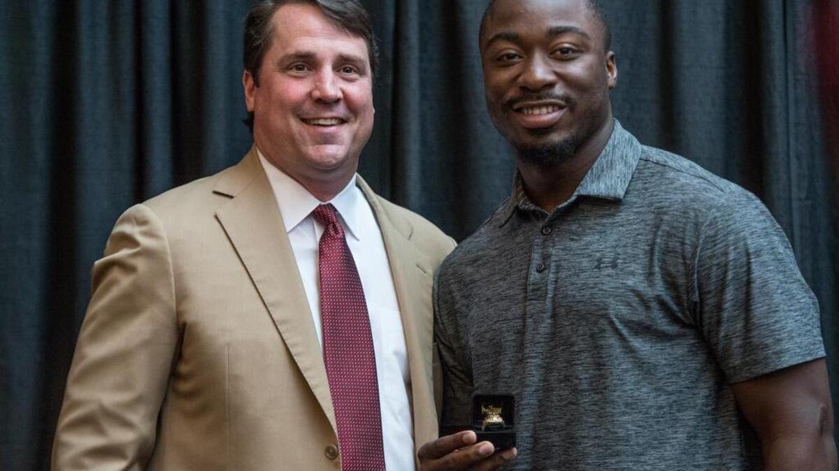 South Carolina head football coach Will Muschamp and Marcus Lattimore