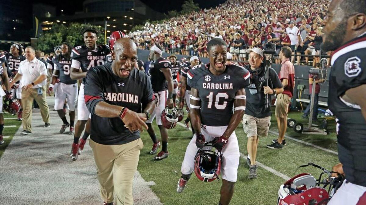 South Carolina defensive coordinator and cornerback Rashad Fenton celebrate the win over Vanderbilt on Thursday.