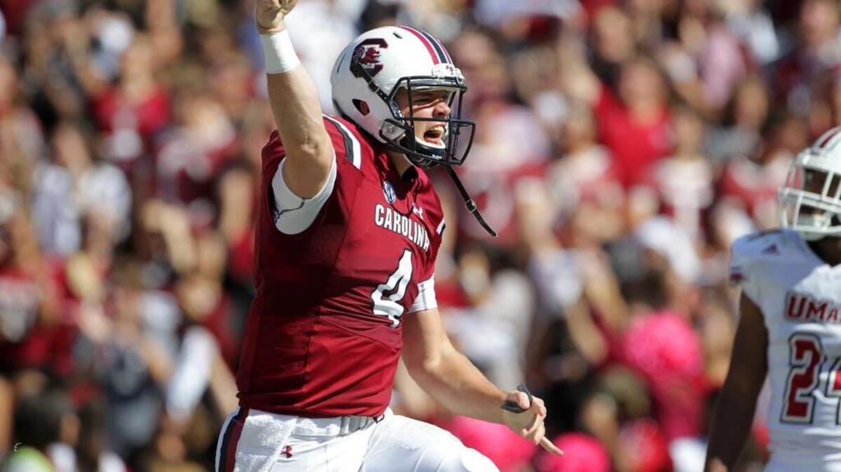 South Carolina quarterback Jake Bentley (4) celebrates a touchdown pass against UMass at Williams-Brice Stadium on Saturday.