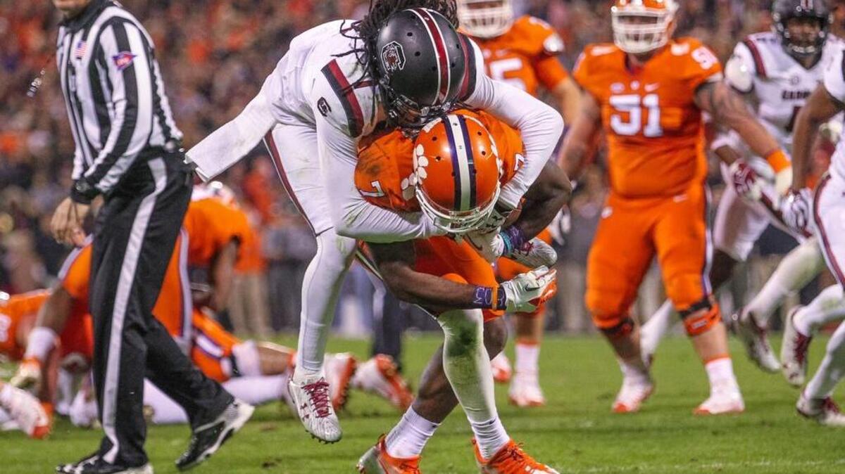 Clemson wide receiver Mike Williams (7) carries South Carolina defensive back Jamarcus King (7) over the goal line for a touchdown during their game Saturday.