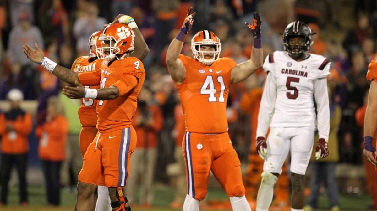 Clemson quarterback Deshaun Watson (4) and tight end Grant Radakovich (41) celebrate the win over South Carolina.