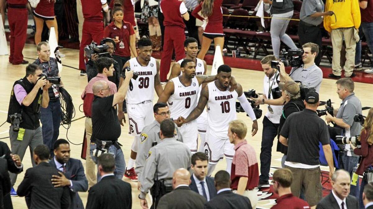 South Carolina Gamecocks senior guards Sindarius Thornwell (0) and Duane Notice (10) walk off the court after their win over Mississippi State