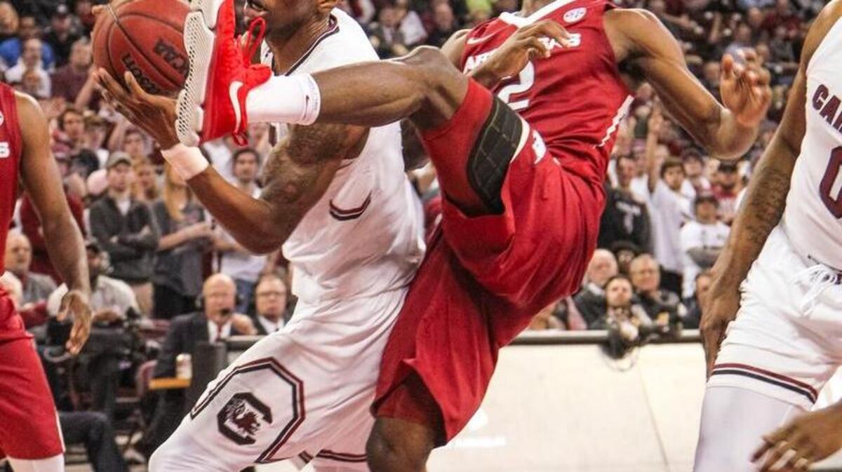 South Carolina forward Chris Silva (30) comes down with a rebound over Arkansas forward Adria Bailey (2) during the game at Colonial Life Arena.