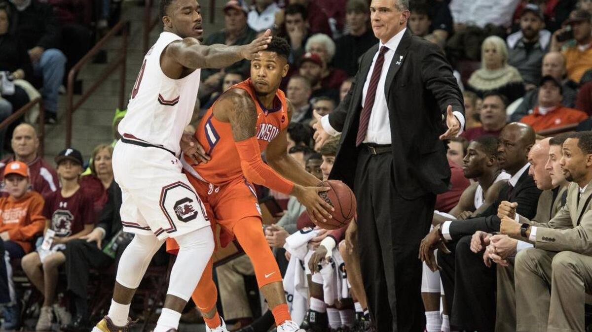 USC's Duane Notice (10) blocks Clemson's Shelton Mitchell (4) at the edge of the court during the first half of their game.