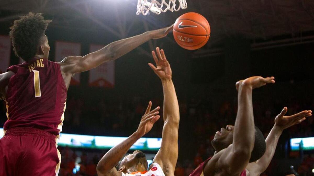 Feb 25, 2017; Clemson, SC, USA; Florida State Seminoles forward Jonathan Isaac (1) blocks the shot by Clemson Tigers guard Shelton Mitchell (4) during the second half at Littlejohn Coliseum. Seminoles won 76-74.