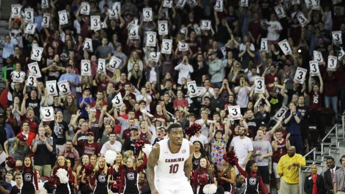 South Carolina fans cheer after a 3-pointer against Alabama.