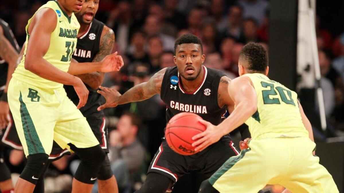 South Carolina guard Duane Notice (10) defends Baylor guard Manu Lecomte (20) in their NCAA Tournament game inside Madison Square Garden.