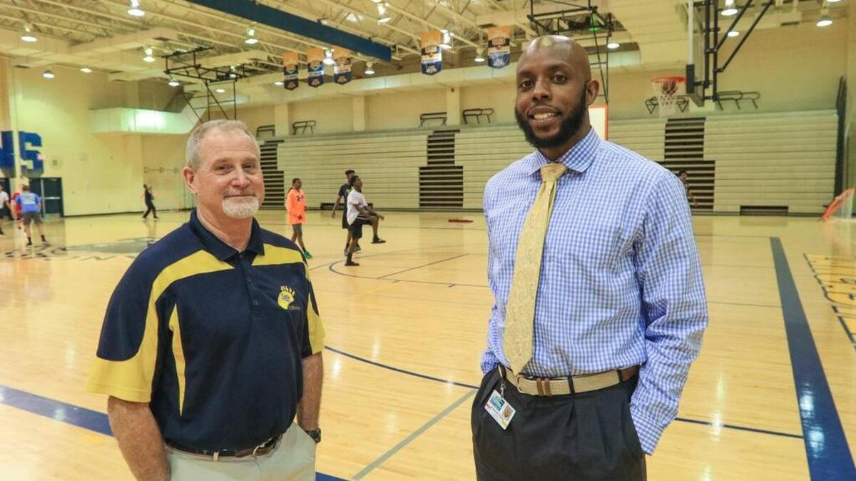 Lancaster High School’s basketball coach Ricardo Priester, right, once told a young Sindarius Thornwell to turn in his jersey. Mark Strickland, left, is the school’s athletic director. They and the whole town are thrilled about Thornwell and the Gamecocks competing in the Final Four tournament this weekend.