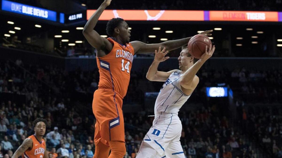 Clemson forward Elijah Thomas (14) guards Duke's Luke Kennard during the second half Wednesday.