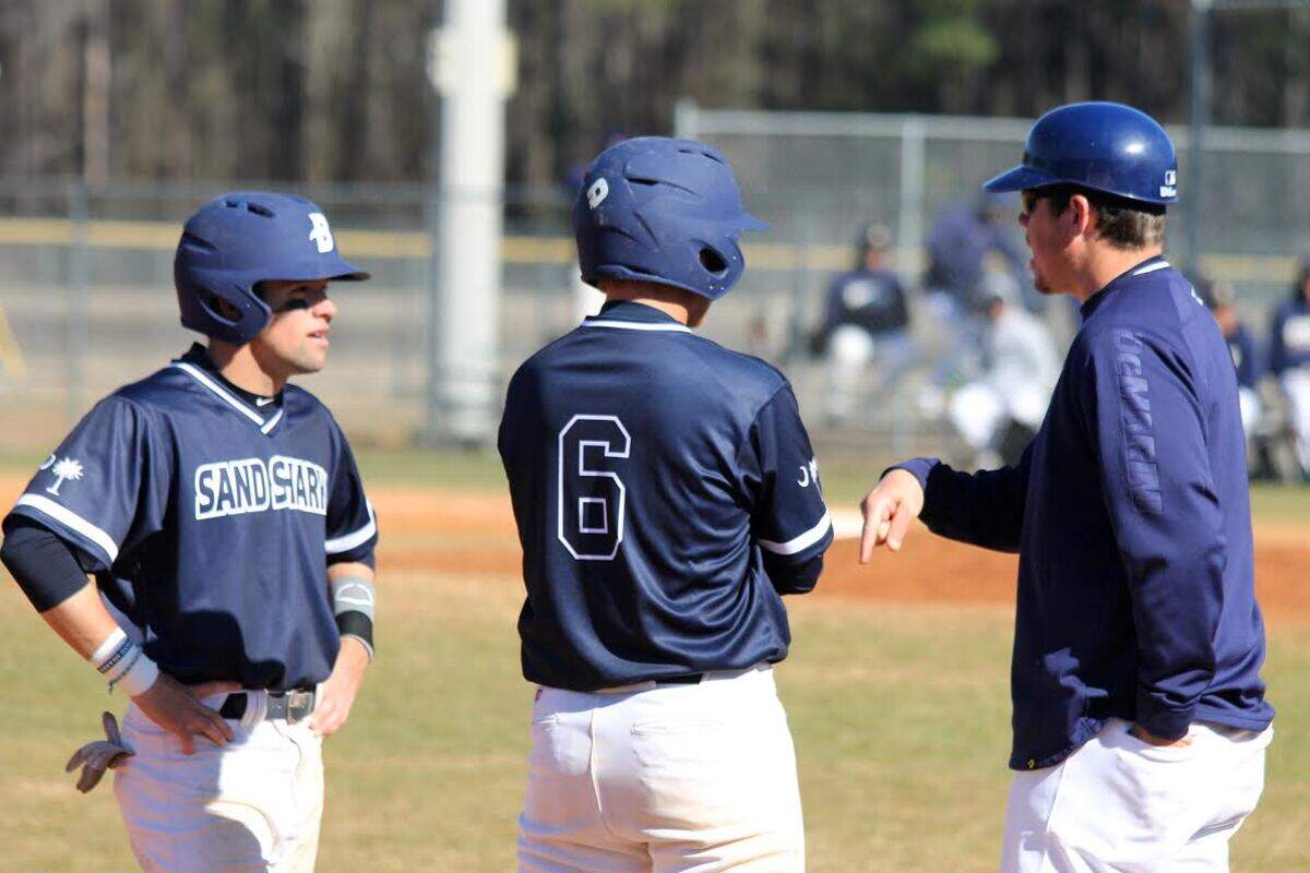 2016 USC Beaufort assistant baseball coach Pat Cottrell chats with players Josh Reinhart and John Cloyd.