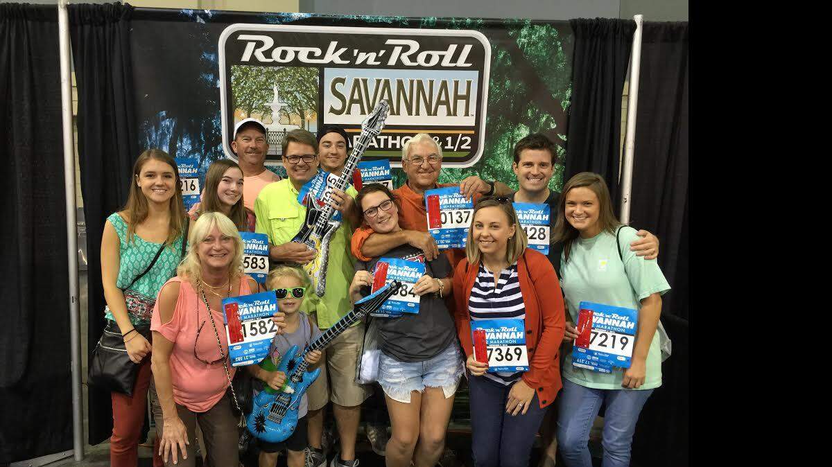 Members of the Althoff family pose after receiving their race packets for Saturday's Rock 'n' Roll Half-Marathon in Savannah, Ga.