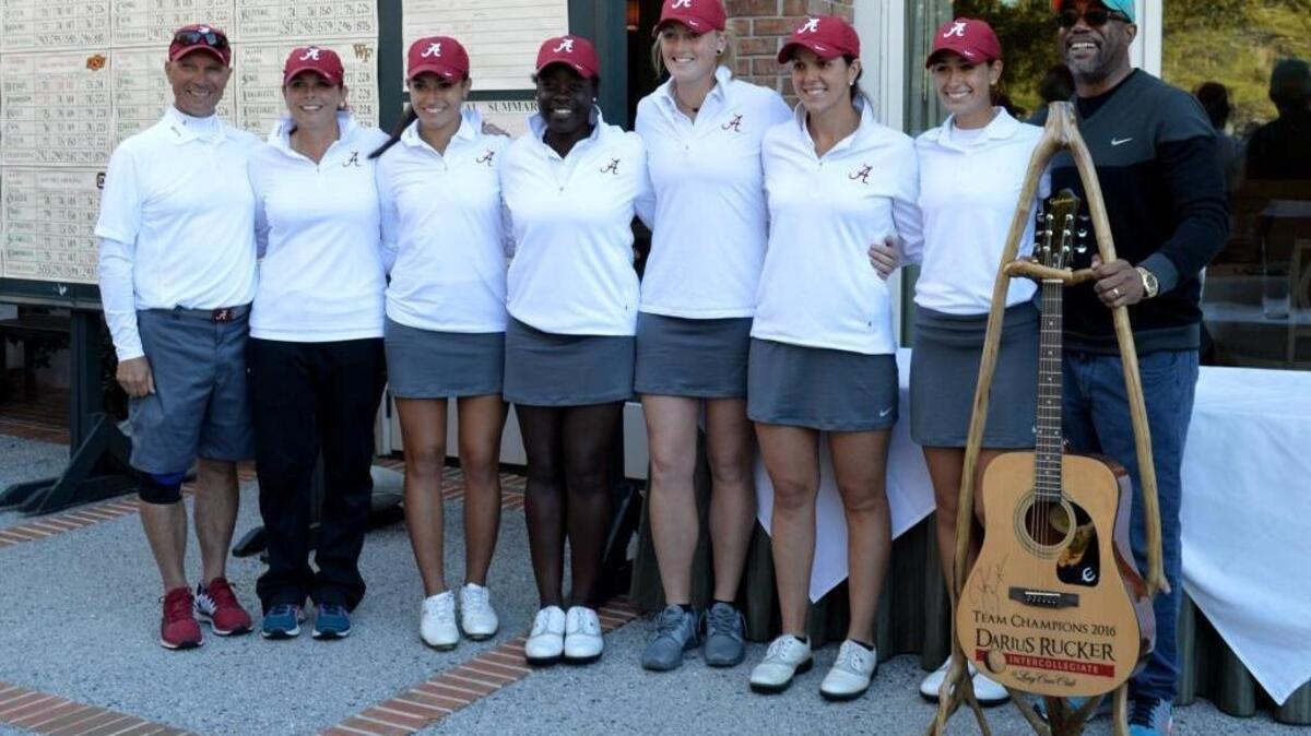 The University of Alabama women's golf team smiles with singer Darius Rucker during the awards ceremony after winning the Darius Rucker Intercollegiate on Sunday afternoon at Long Cove Club. The Crimson Tide won its third team title.