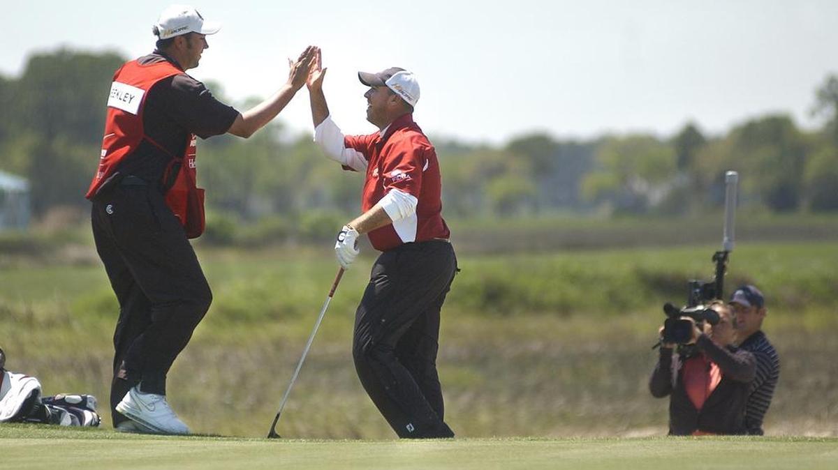 Boo Weekley, center, high fives his caddie, after chipping in to save par and secure his victory in the 2007 Verizon Heritage on at Harbour Town Golf Links on Hilton Head Island.