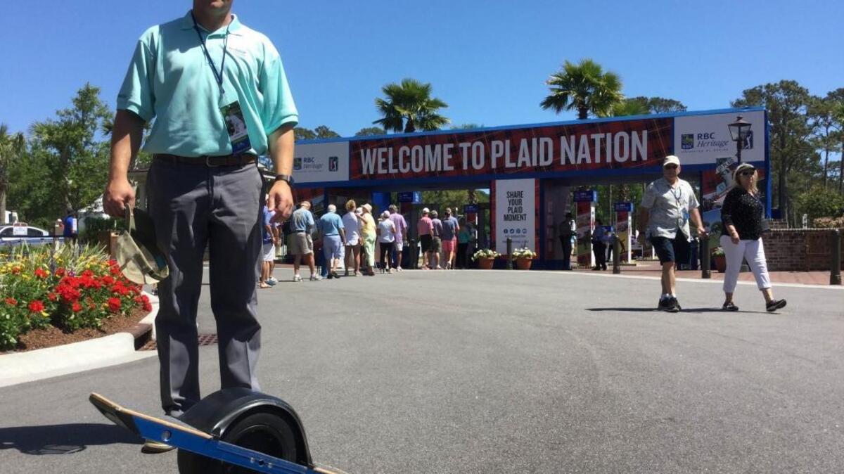 Brian DeChirico, of Savannah, poses with his Onewheel motorized skateboard on April 13, 2017, in front of the main entrance to the RBC Heritage Presented by Boeing golf tournament at Harbour Town Golf Links on Hilton Head Island, S.C. DeChirico found out that his Onewheel was not allowed into the tournament, or into the Sea Pines community. That surprised him, because he’d ridden the wheel three miles from his car to Harbour Town, and no one initially said anything to him about it.