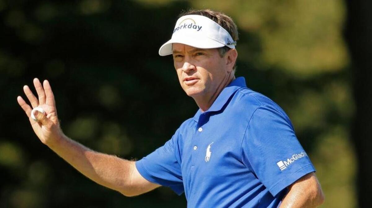 Davis Love III waves to the crowd on the 18th hole in the 2015 Wyndham Championship golf tournament in Greensboro, N.C.