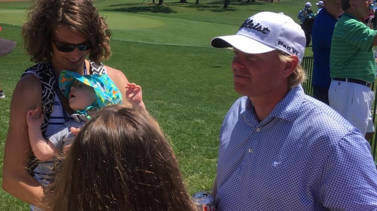 Mark Anderson, right, visits with his wife, Meredith, and son, Ian, after the first round of the RBC Heritage at Harbour Town Golf Links on Thursday. The Beaufort resident shot 2-under-par 69.