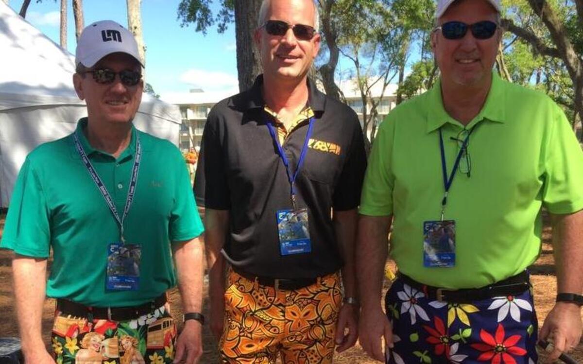 (from left) Steve, Dave Snively and Rodney McDonald have sported crazy, colorful patterned pants or shorts at each RBC Heritage golf tournament for the last 15 years.
