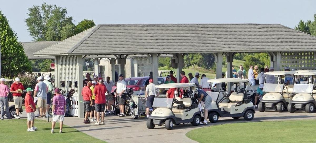 File: Golfers check in and wait for cart assignments at Legends Golf Resort on a June morning in 2015.