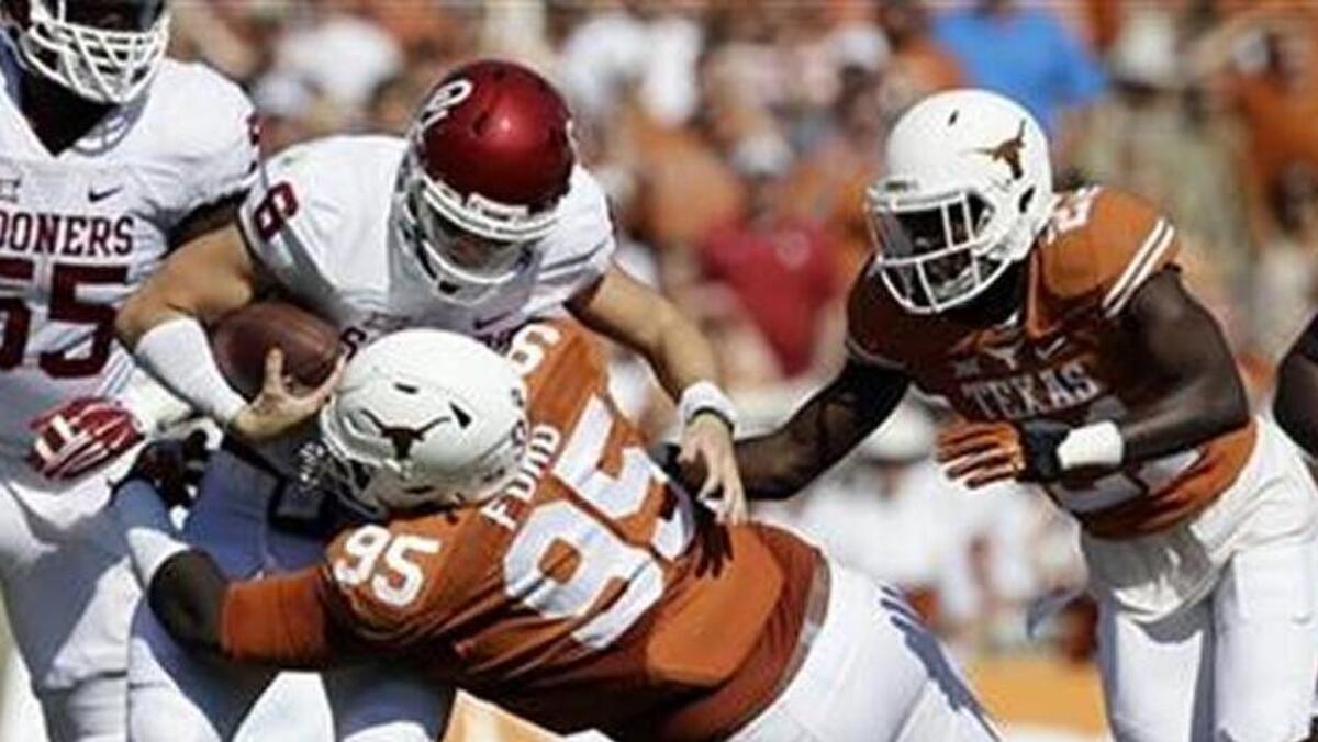 Former Hilton Head Island standout and current Texas defensive lineman Poona Ford makes a tackle of Oklahoma’s Baker Mayfield. Ford is one of the finalists for the South Carolina Football Hall of Fame’s Blanchard-Rogers Award.