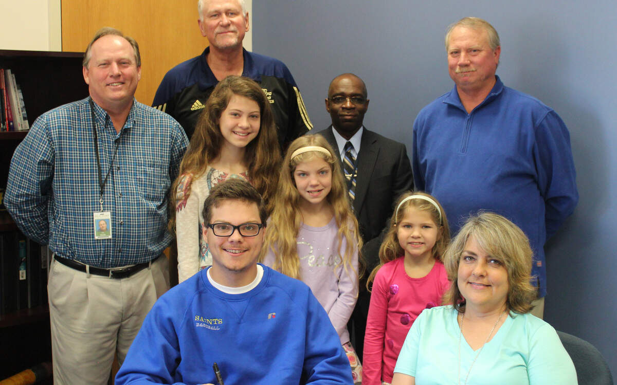 Battery Creek's Henry Schubert signs his letter of intent to play baseball at Limestone on Tuesday, surrounded by, from left, Battery Creek baseball coach Les Goude, Battery Creek athletic director John Drafts, sister Margaret Schubert, sister Gabriella Schubert, Battery Creek principal Edmund Burnes, sister Stella Schubert, father Keith Schubert and mother Kristie Schubert.