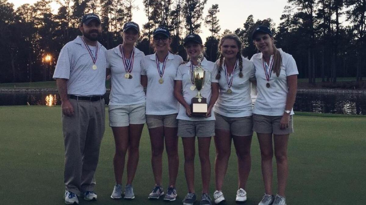 Hilton Head Christian basks in its second SCISA girls’ golf title Tuesday at Orangeburg Country Club. From left, coach Parker Collins, Anna Lesemann Eddy, Jamie Hubbard, Rebecca Hubbard, Emma Grace Walters, Natalie Wade.