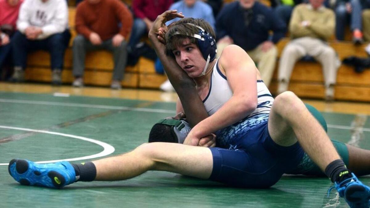 Hilton Head’s Jeb Lesch holds down Beaufort’s Elijah Thrower for a pin during their 160-pound match in the Class 3-A Lower State wrestling championship on Wednesday night at Beaufort High School on Lady’s Island.