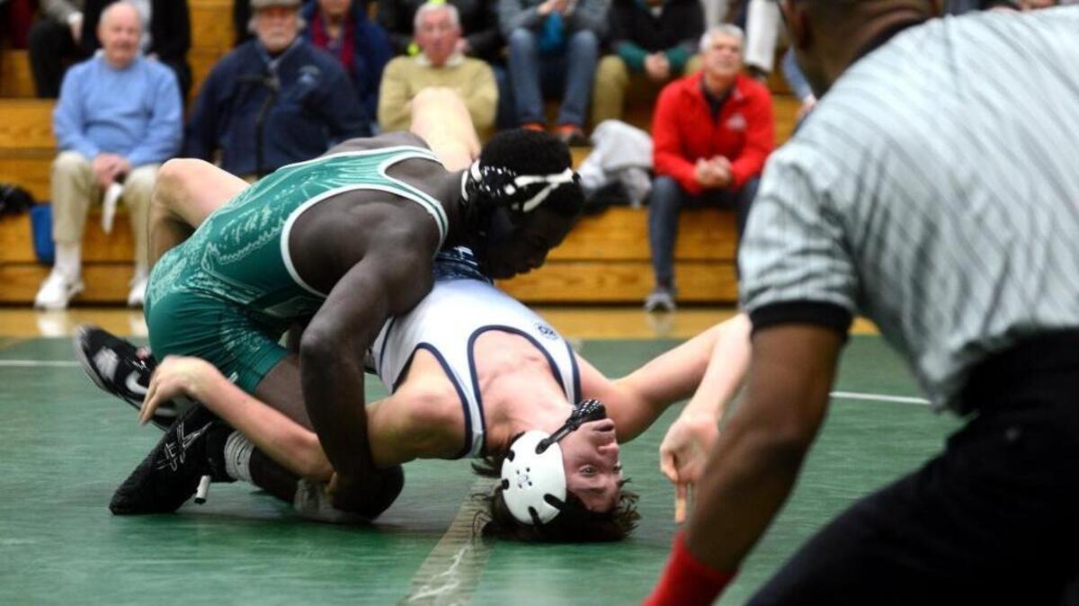 Beaufort's William Spann flips Hilton Head's Kai Liska while trying to pin him during their 132-pound match at Wednesday night’s Class 3-A Lower State Wrestling Championship at Beaufort High School.