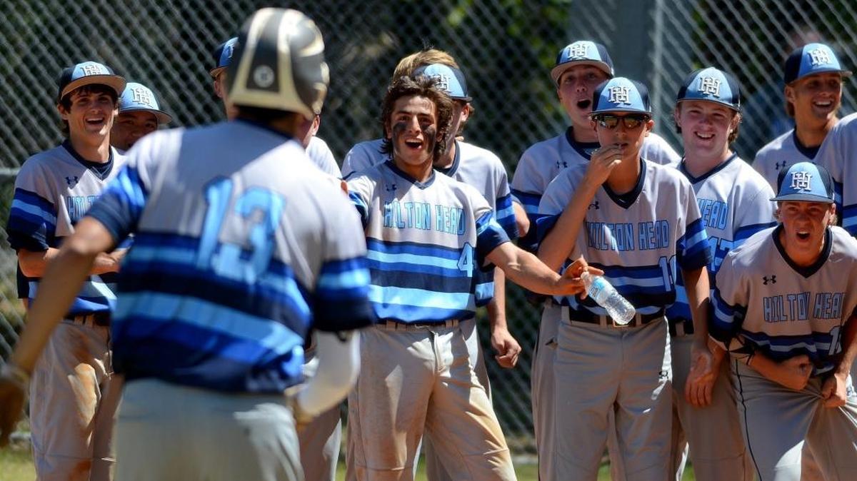 Hilton Head Island’s Eric Foggo (13) gets a warm welcome at home plate after hitting a home run against Beaufort on Saturday, May 6, 2017, at Beaufort High School.