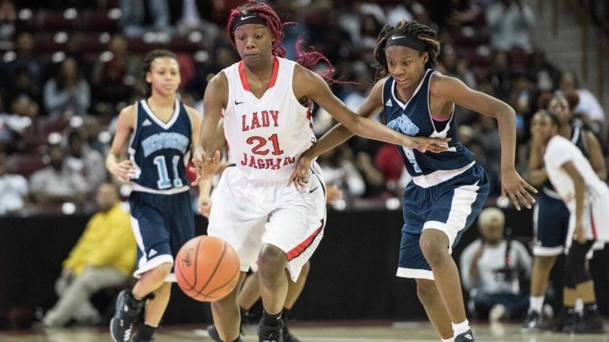 Kendalyeshsha Washington, left, dribbles during the 2017 Class 3A championship game against Newberry. Ridgeland-Hardeeville boys are ranked No. 1 and the girls No. 2 in SC Basketball Coaches preseason polls.