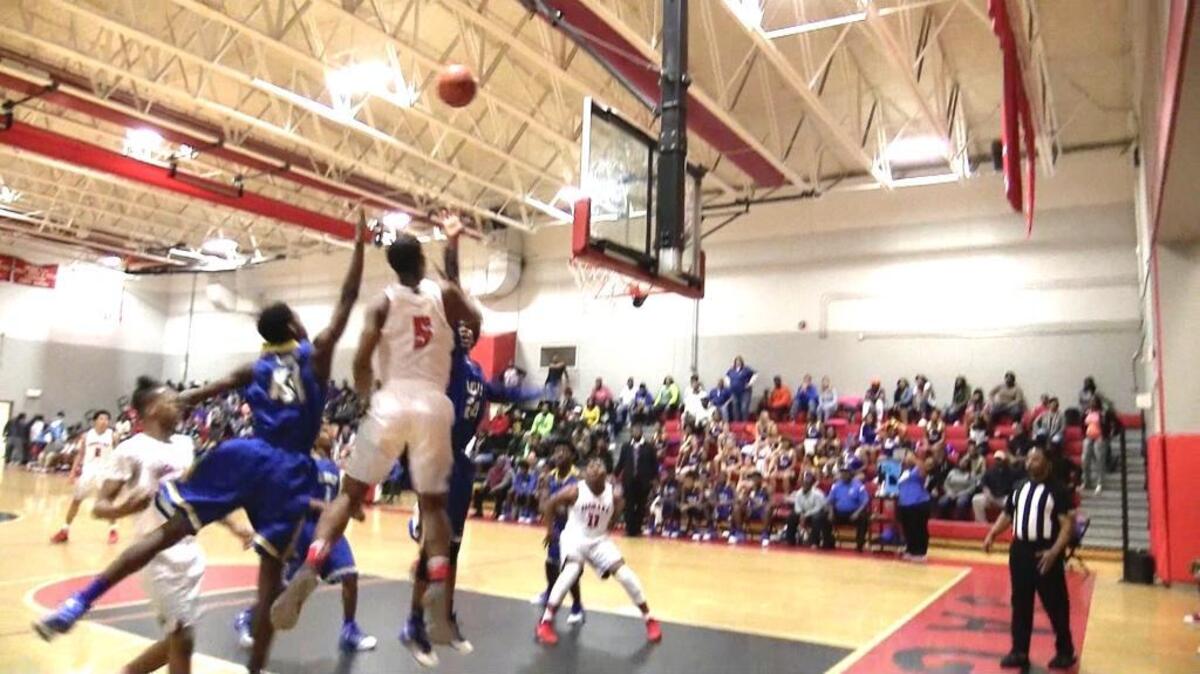 Ridgeland-Hardeeville guard-forward Devin Butler (5) watches as his floater heads toward the rim in a second-round playoff game against Loris on Feb. 17, 2017, in Ridgeland.