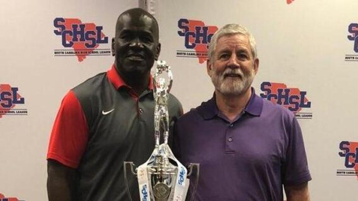 Ridgeland-Hardeeville boys basketball coach Jeremiah Faber, left, poses for a photo with Southside’s Steve Beasley on Monday at SCHSL media day for state basketball championships.