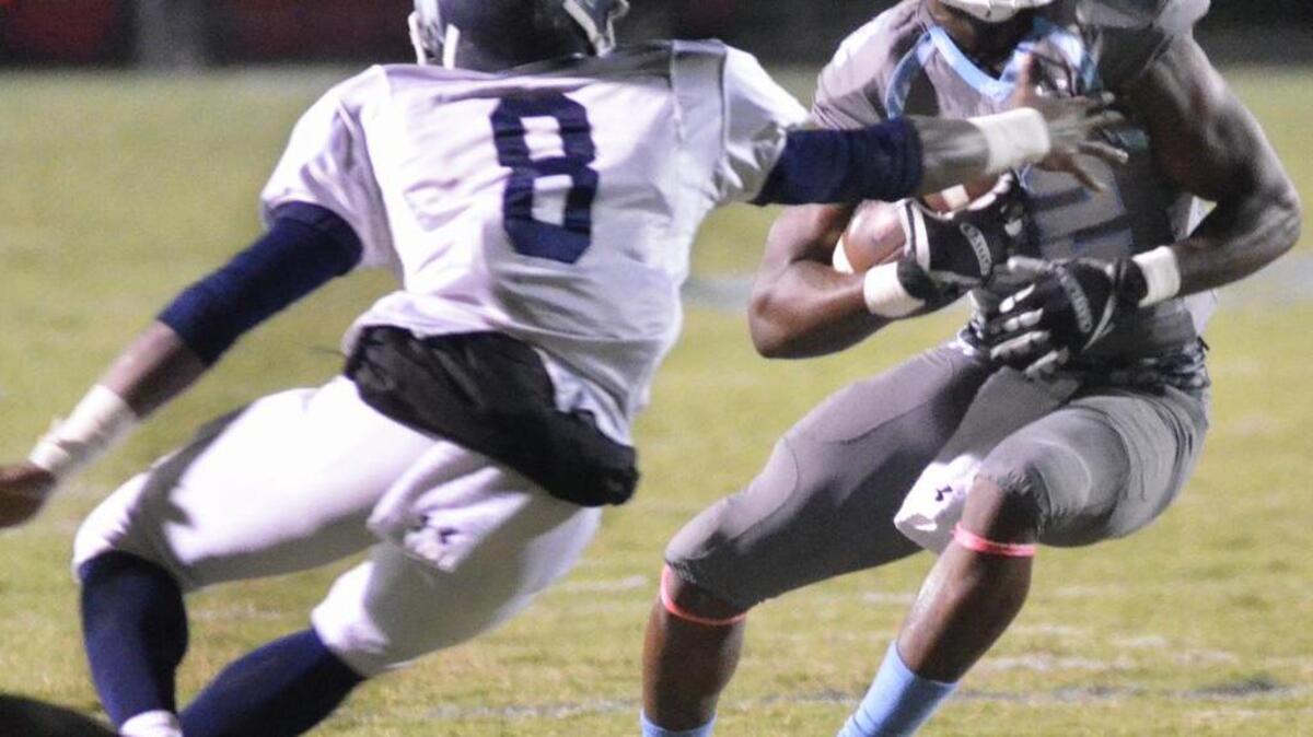 Hilton Head Island’s PJ Franklin (22) looks to evade Stall’s Juwan Scott at Hilton Head Island on Oct. 21, 2016.