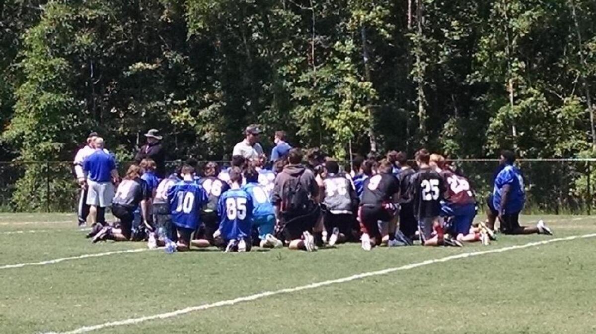 May River coach Rodney Summers addresses his team Saturday at the conclusion of its first spring workout at River Ridge Academy.