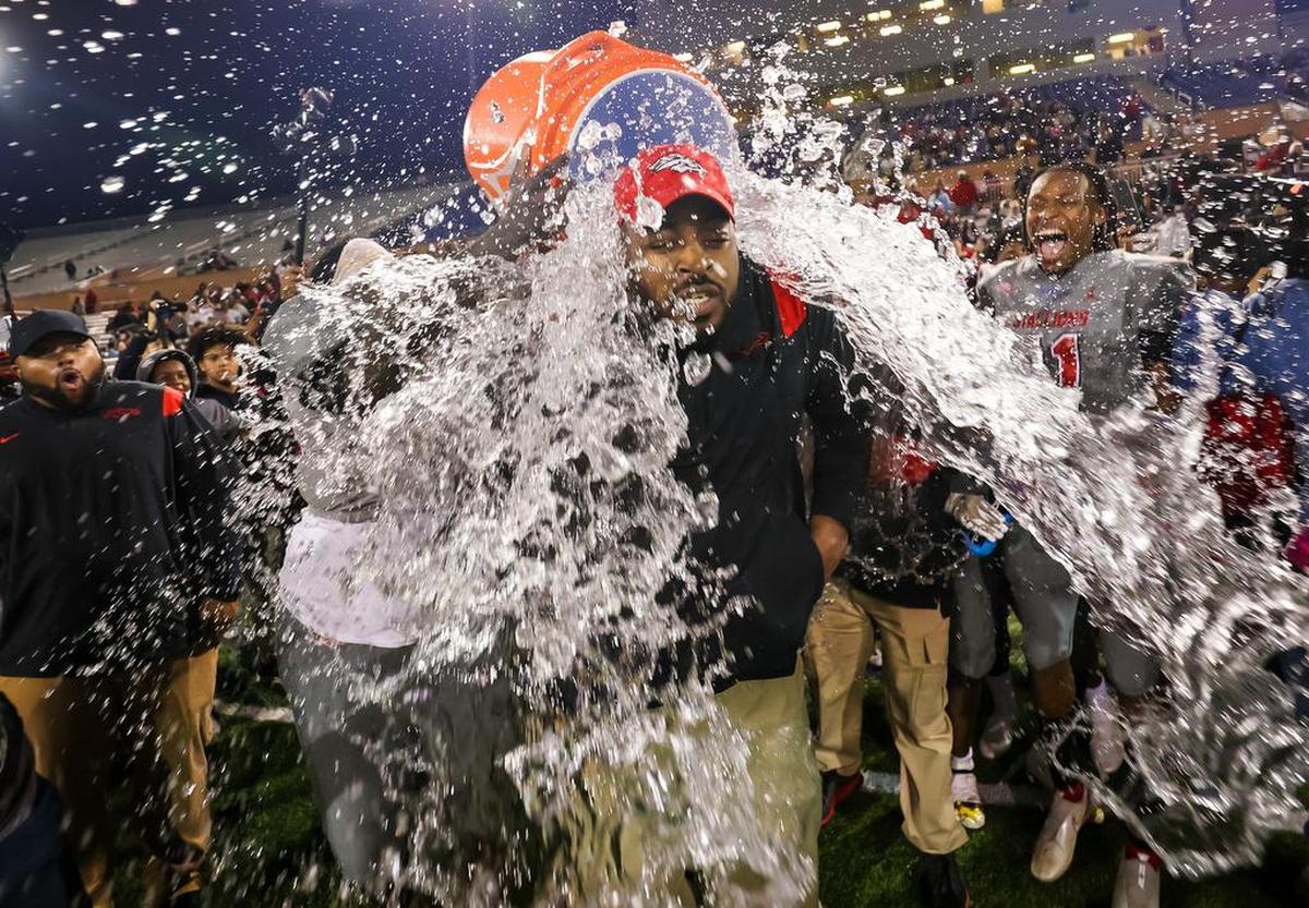 South Pointe head coach DeVonte’ Holloman gets a Gatorade bath celebrating the team’s win over Beaufort Eagles in the Class 4A SC State Championship Game at Benedict College in Columbia, SC, Thursday night, December 2, 2021.