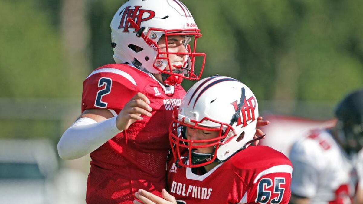 Hilton Head Prep quarterback Stone McDonald (2) and offensive lineman Christian Britschge (65) celebrate a touchdown against Northside Christian on Friday at Hilton Head.