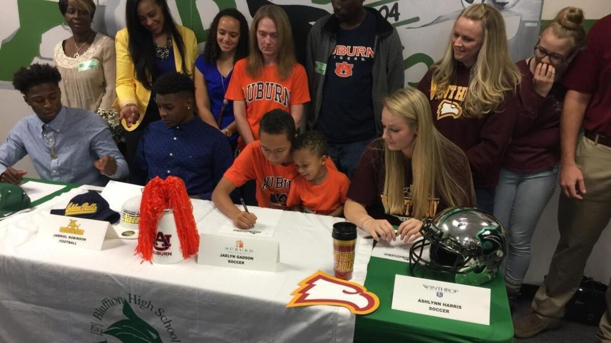 From left to right, Bluffton High School athletes Cameron Bent (football, UNC Charlotte), Jabriel Robinson (football, Johnson C. Smith), Jaelyn Gadson (women's soccer, Auburn) and Ashlynn Harris (women's soccer, Winthrop) participate in a Feb. 1, 2017, National Signing Day event at the school.