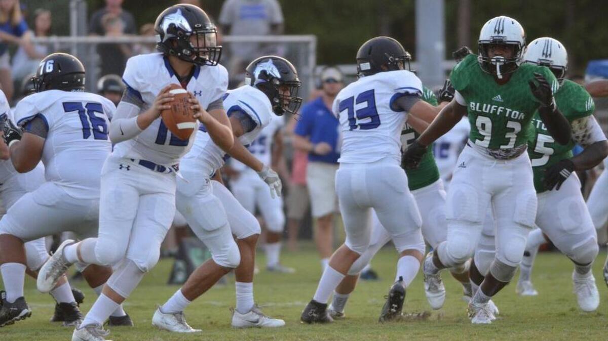 The May River High School Sharks football team plays its first ever game with its crosstown rival, the Bluffton Bobcats, at Bluffton High School on Friday, Aug. 26, 2016.