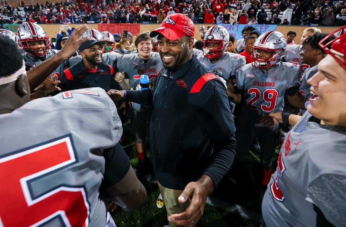 South Pointe head coach DeVonte’ Holloman celebrates the team’s win over Beaufort Eagles in the Class 4A SC State Championship Game at Benedict College in Columbia, SC, Thursday night, December 2, 2021.