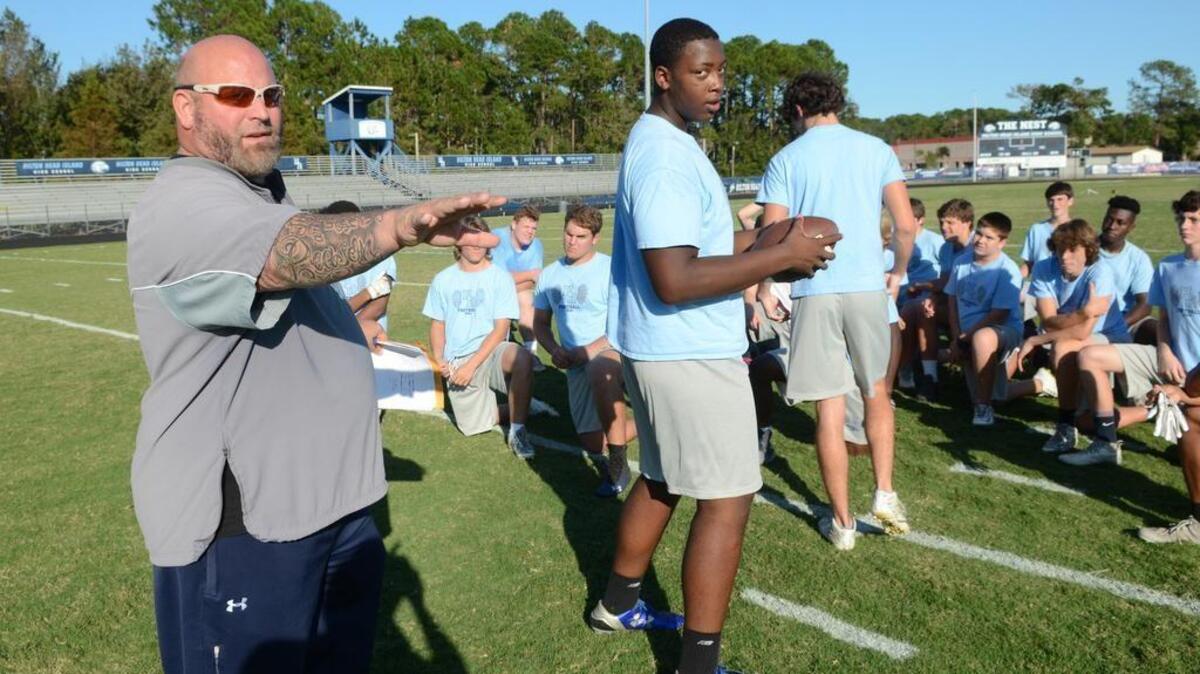 Hilton Head Island High School football coach BJ Payne has had his players helping islanders clean up after Hurricane Matthew. Here, he divvies up the team into squads on Oct. 20 to tackle jobs at eight locations on the north end of the island.