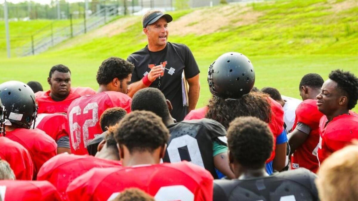 Former Westwood High head coach Rodney Summers, now head coach at the new May River High School, talks to his players before starting drills on Aug. 10, 2015.