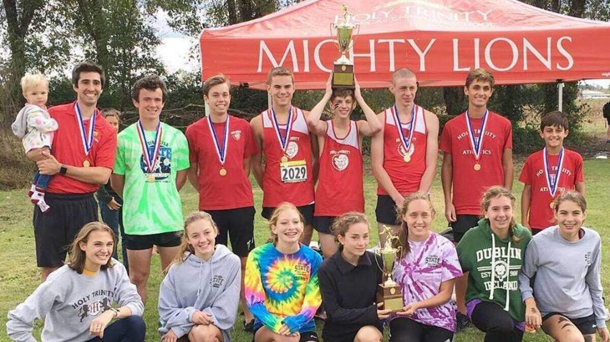 The Holy Trinity boys win the SCISA Class A cross country championship and the girls finished second Saturday at Heathwood Hall in Columbia.